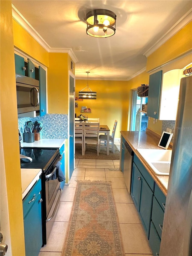 1098 Henry Balch Dr, Orlando, FL 32810 - kitchen with crown molding, light tile patterned floors, decorative backsplash, and stainless steel appliances