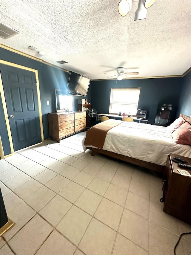 1098 Henry Balch Dr, Orlando, FL 32810 - bedroom featuring ceiling fan, a textured ceiling, and visible vents