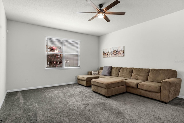 living area with baseboards, a textured ceiling, a ceiling fan, and carpet floors