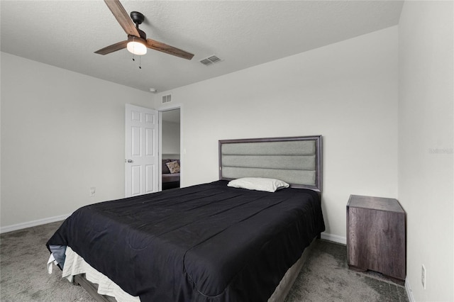 carpeted bedroom with ceiling fan, baseboards, and visible vents