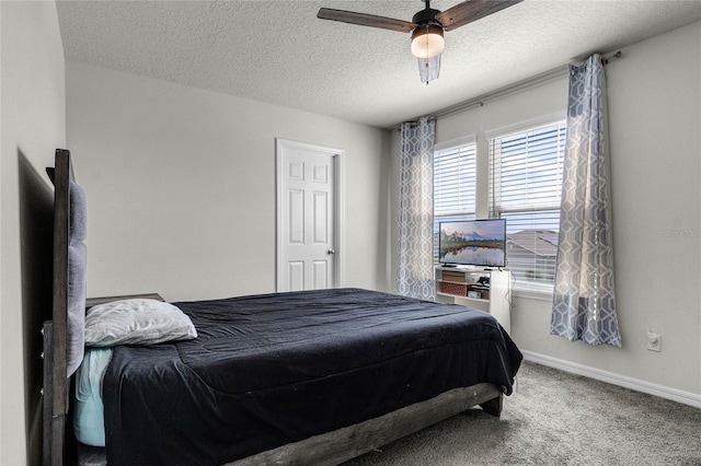 bedroom with a textured ceiling, ceiling fan, baseboards, and carpet