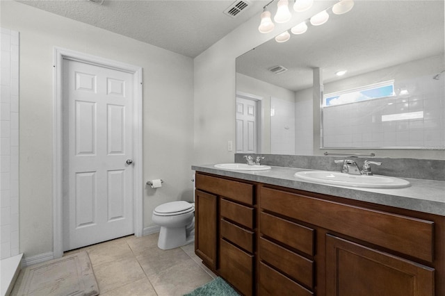 full bathroom featuring tile patterned flooring, visible vents, a sink, and toilet