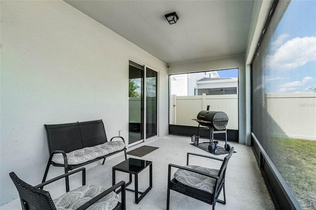 sunroom featuring an outdoor hangout area