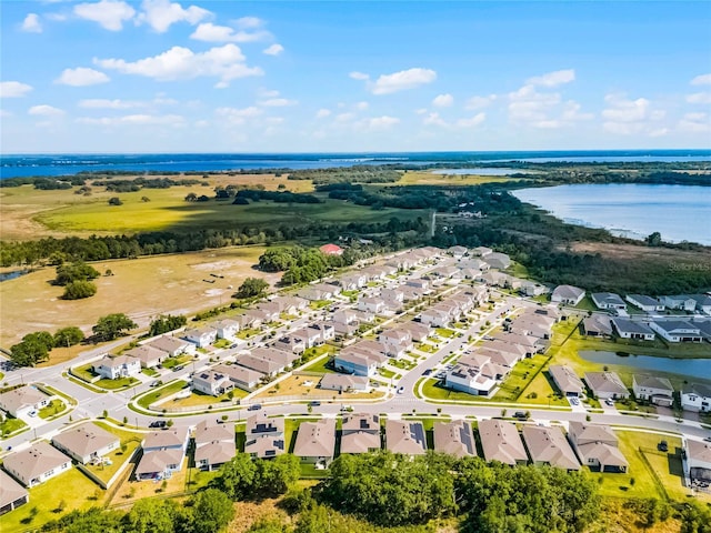 bird's eye view featuring a residential view and a water view