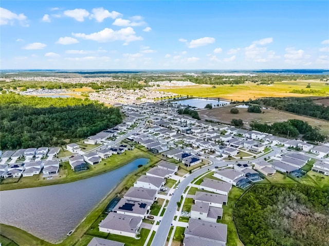 birds eye view of property featuring a water view and a residential view