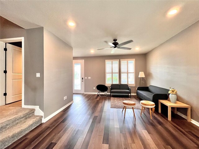 living area featuring recessed lighting, a ceiling fan, wood finished floors, and baseboards