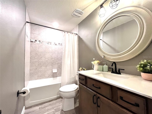 bathroom with visible vents, toilet, shower / bath combination with curtain, wood finished floors, and vanity