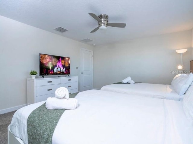 428 Ocean Course Ave, Davenport, FL 33896 - bedroom with carpet floors, baseboards, and ceiling fan