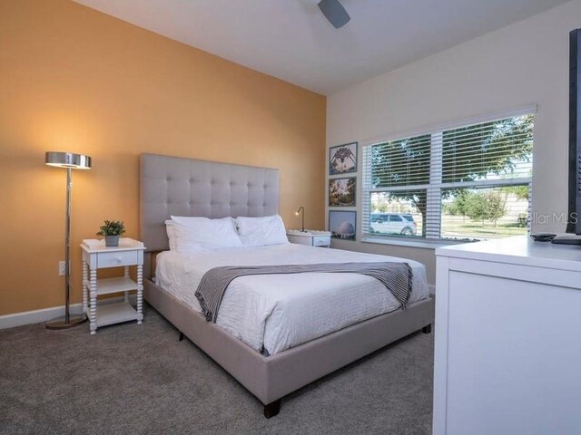 428 Ocean Course Ave, Davenport, FL 33896 - bedroom featuring carpet flooring, baseboards, and a ceiling fan