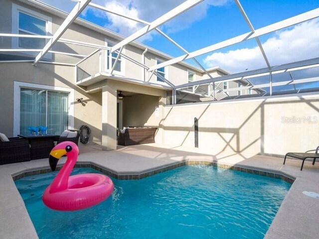 428 Ocean Course Ave, Davenport, FL 33896 - outdoor pool featuring a patio and glass enclosure