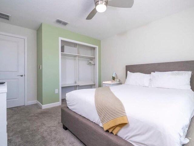 428 Ocean Course Ave, Davenport, FL 33896 - bedroom with a closet, carpet flooring, ceiling fan, and baseboards