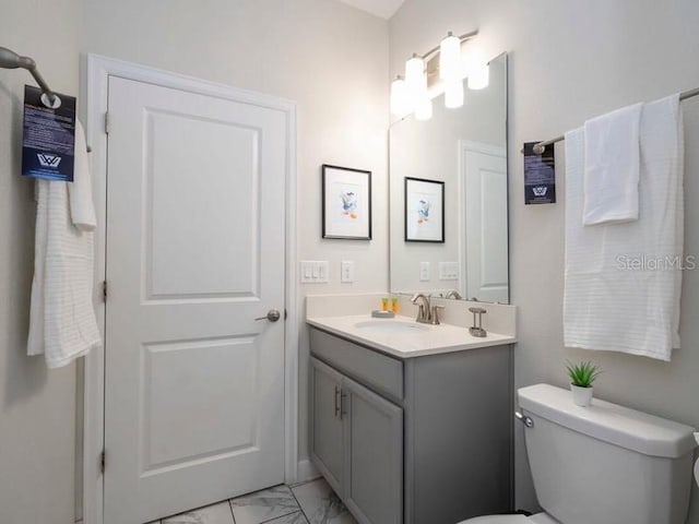 428 Ocean Course Ave, Davenport, FL 33896 - bathroom with marble look tile flooring, vanity, and toilet