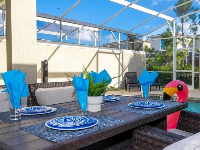 428 Ocean Course Ave, Davenport, FL 33896 - view of patio / terrace with a lanai and an outdoor fire pit