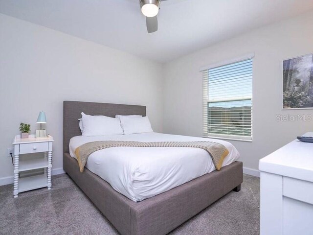 428 Ocean Course Ave, Davenport, FL 33896 - carpeted bedroom featuring baseboards and a ceiling fan