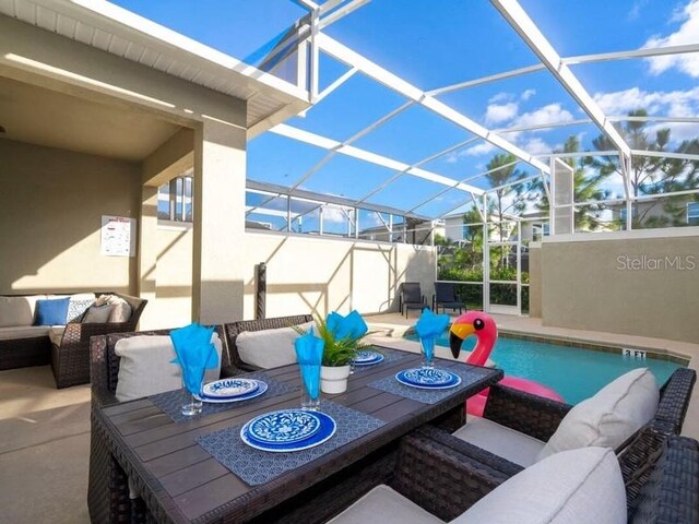 428 Ocean Course Ave, Davenport, FL 33896 - view of patio with an outdoor hangout area, an outdoor pool, a lanai, and outdoor dining space