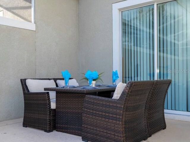 428 Ocean Course Ave, Davenport, FL 33896 - view of patio with outdoor dining area