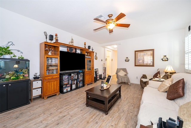 2289 Aloe Aly, Apopka, FL 32703 - living room with light wood-style floors, visible vents, baseboards, and ceiling fan