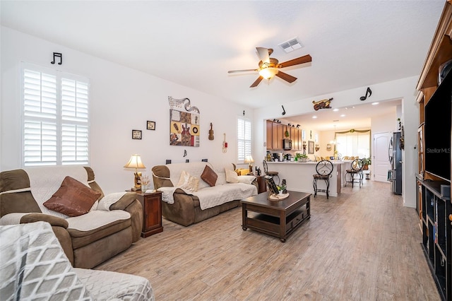 2289 Aloe Aly, Apopka, FL 32703 - living room with a ceiling fan, visible vents, and light wood-style floors