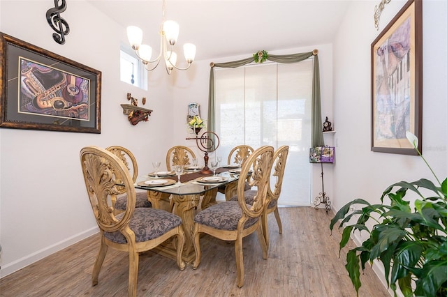 2289 Aloe Aly, Apopka, FL 32703 - dining area featuring a notable chandelier and light wood-style flooring