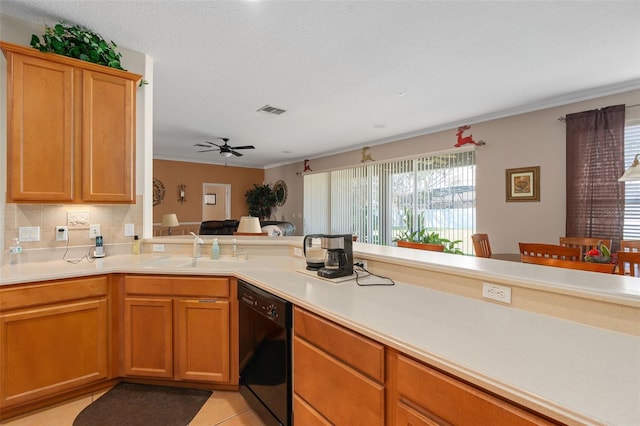 920 Nola Dr, Ocoee, FL 34761 - kitchen with dishwasher, light countertops, crown molding, ceiling fan, and light tile patterned floors