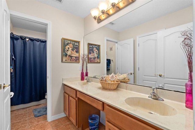 920 Nola Dr, Ocoee, FL 34761 - full bathroom featuring double vanity, tile patterned flooring, and a shower with curtain