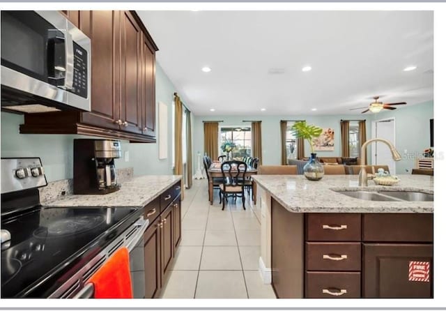 kitchen featuring a sink, a ceiling fan, light tile patterned floors, stainless steel appliances, and recessed lighting