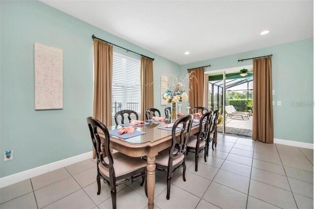 dining area with light tile patterned flooring, baseboards, and recessed lighting