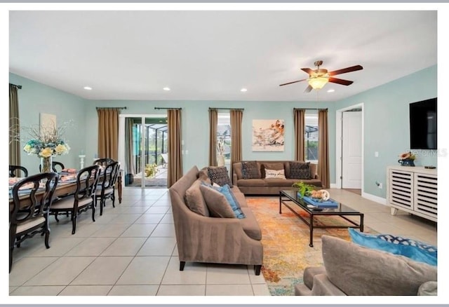 living room with baseboards, a ceiling fan, recessed lighting, and light tile patterned floors