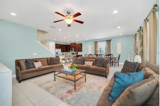 living area featuring a ceiling fan, light tile patterned floors, baseboards, and recessed lighting