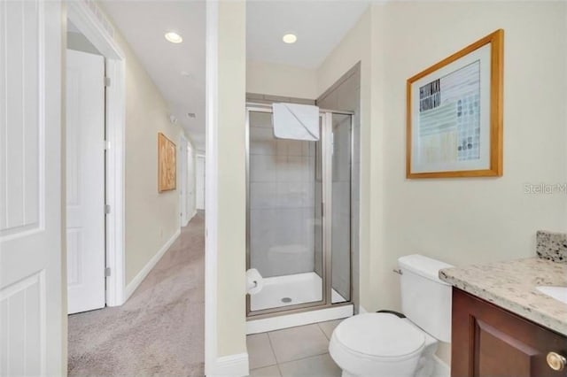 full bath with vanity, toilet, tile patterned floors, and a shower stall