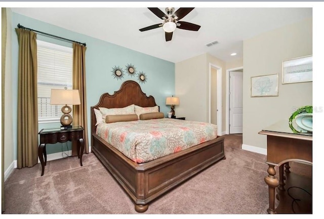 bedroom with baseboards, visible vents, multiple windows, and carpet