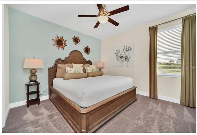 bedroom with baseboards, carpet flooring, and a ceiling fan