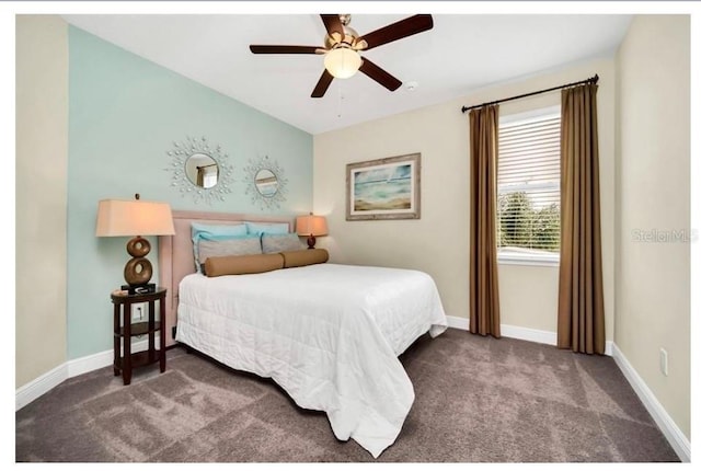 carpeted bedroom with a ceiling fan and baseboards