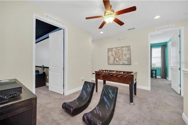 rec room featuring carpet floors, ceiling fan, and visible vents
