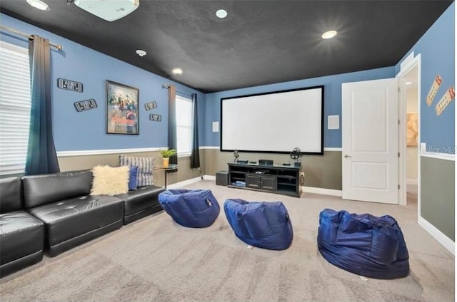 cinema with baseboards and carpet floors