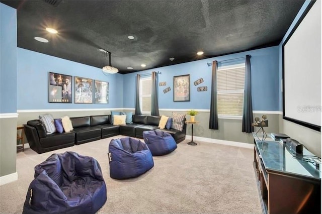 home theater featuring baseboards, carpet floors, a textured ceiling, and recessed lighting