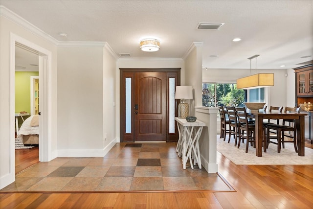 7849 Georgeann St, Winter Park, FL 32792 - entrance foyer with baseboards, crown molding, and wood finished floors
