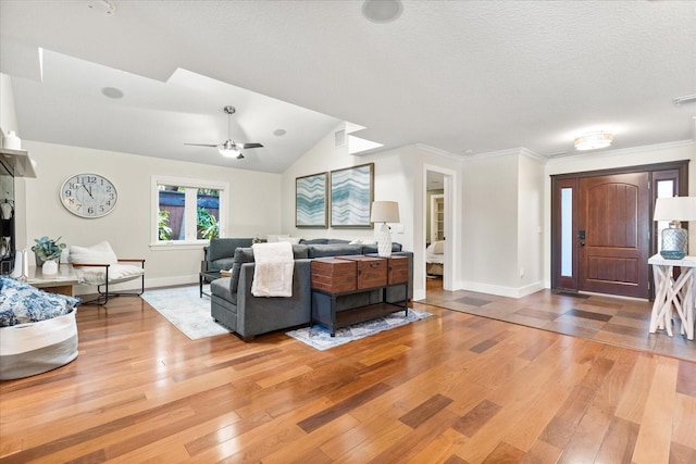 7849 Georgeann St, Winter Park, FL 32792 - living area with hardwood / wood-style flooring, baseboards, a ceiling fan, a textured ceiling, and crown molding