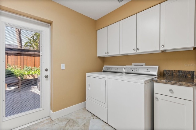 7849 Georgeann St, Winter Park, FL 32792 - laundry room featuring baseboards, cabinet space, and separate washer and dryer