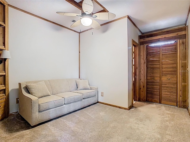 410 Sandspur Rd N, Maitland, FL 32751 - living room with baseboards, crown molding, carpet floors, and a ceiling fan