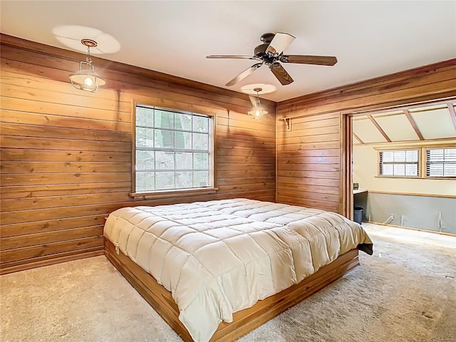 410 Sandspur Rd N, Maitland, FL 32751 - bedroom featuring carpet floors, wood walls, and a ceiling fan