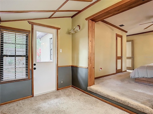 410 Sandspur Rd N, Maitland, FL 32751 - foyer entrance with lofted ceiling, visible vents, ceiling fan, and carpet