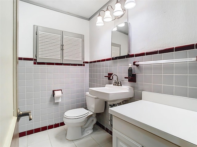 410 Sandspur Rd N, Maitland, FL 32751 - half bathroom with a sink, toilet, tile walls, and tile patterned flooring