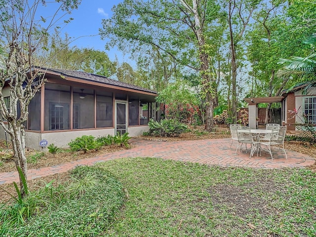410 Sandspur Rd N, Maitland, FL 32751 - view of yard featuring a sunroom and a patio