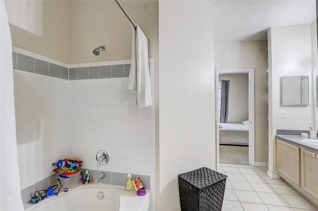 ensuite bathroom with ensuite bathroom, a washtub, a shower with shower curtain, tile patterned floors, and vanity