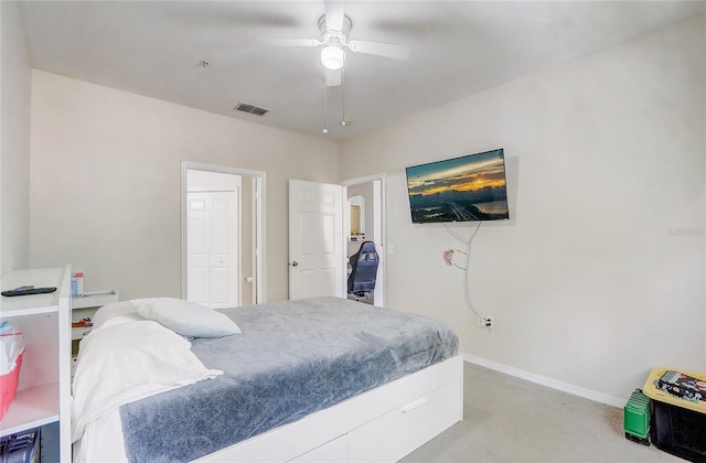 bedroom with light carpet, baseboards, ceiling fan, and visible vents