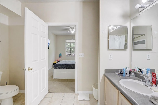 full bathroom featuring baseboards, ceiling fan, toilet, vanity, and tile patterned flooring