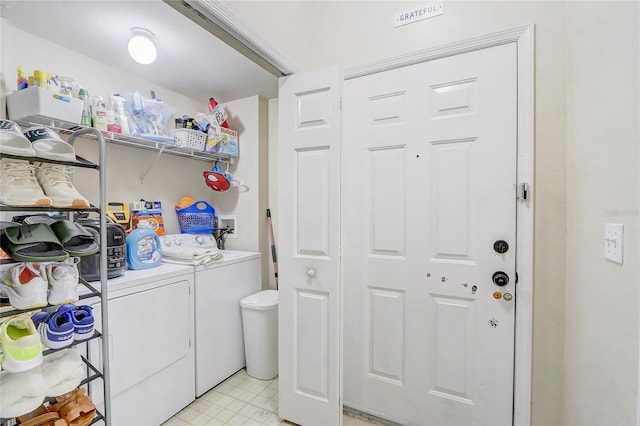 washroom featuring washer and clothes dryer and laundry area