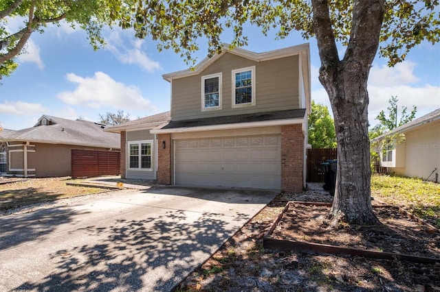 10724 Harkwood Blvd, Orlando, FL 32817 - traditional-style home featuring brick siding, an attached garage, fence, and concrete driveway