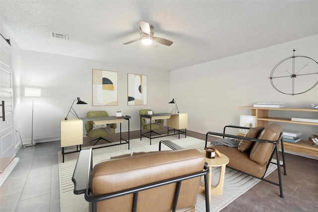 10724 Harkwood Blvd, Orlando, FL 32817 - tiled living area featuring a textured ceiling, ceiling fan, baseboards, and visible vents